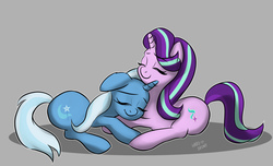 Size: 1600x974 | Tagged: safe, artist:hardbrony, starlight glimmer, trixie, pony, unicorn, g4, cuddling, cute, diatrixes, duo, eyes closed, female, floppy ears, glimmerbetes, gray background, lesbian, mare, prone, ship:startrix, shipping, signature, simple background, smiling, snuggling