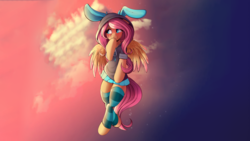 Size: 2905x1634 | Tagged: safe, artist:sugarlesspaints, edit, fluttershy, pegasus, pony, semi-anthro, g4, blushing, bunny ears, clothes, colored pupils, colored wings, colored wingtips, costume, cute, dangerous mission outfit, female, flying, hoodie, mare, shyabetes, smiling, socks, solo, striped socks, sunset, wallpaper, wallpaper edit