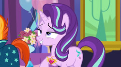 Size: 684x378 | Tagged: safe, screencap, starlight glimmer, sunburst, pony, unicorn, celestial advice, g4, balloon, duo, equestrian pink heart of courage, female, flower, lidded eyes, male, mare, offscreen character, raised hoof, smiling, solo focus, stallion, twilight's castle