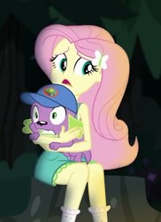 Size: 349x480 | Tagged: safe, screencap, fluttershy, spike, spike the regular dog, dog, equestria girls, g4, my little pony equestria girls: legend of everfree, camp everfree outfits, cap, clothes, hat, hug, scared, skirt, socks