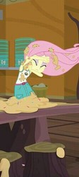 Size: 221x492 | Tagged: safe, screencap, fluttershy, equestria girls, g4, my little pony equestria girls: legend of everfree, camp everfree outfits, clothes, cookie dough, eyes closed, female, messy, shorts, skirt, solo