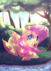 Size: 900x1260 | Tagged: safe, artist:drawntildawn, fluttershy, pegasus, pony, g4, bush, cute, dappled sunlight, female, forest, looking at you, open mouth, prone, river, shade, shyabetes, smiling, solo, watermark