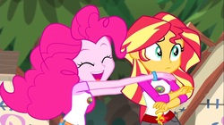 Size: 1100x618 | Tagged: safe, screencap, pinkie pie, sunset shimmer, equestria girls, g4, my little pony equestria girls: legend of everfree, bracelet, camp everfree outfits, eyes closed, incoming hug, jewelry, sun