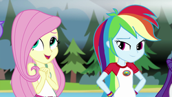 Size: 1280x720 | Tagged: safe, screencap, fluttershy, rainbow dash, rarity, equestria girls, g4, my little pony equestria girls: legend of everfree, camp everfree outfits, clothes, female, hand on hip, lake, mountain, open mouth, tree, wristband