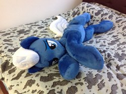 Size: 960x717 | Tagged: safe, artist:burgunzik, night glider, pony, g4, bed, bedroom eyes, irl, photo, plushie, solo