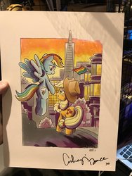 Size: 768x1024 | Tagged: safe, artist:tony fleecs, applejack, rainbow dash, earth pony, pegasus, pony, g4, babscon, backwards cutie mark, duo, gay pride flag, photo, san francisco, traditional art, transamerica pyramid