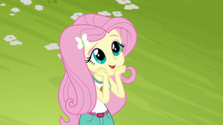 Size: 1280x720 | Tagged: safe, screencap, fluttershy, equestria girls, g4, my little pony equestria girls: legend of everfree, camp everfree outfits, clothes, cute, daaaaaaaaaaaw, female, flower, open mouth, shorts, shyabetes, sleeveless, solo, tank top