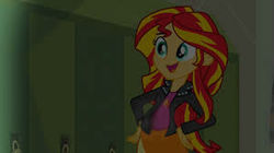 Size: 300x168 | Tagged: safe, edit, edited screencap, screencap, sunset shimmer, comic:a new change, equestria girls, g4, my little pony equestria girls, clothes, female, hand on hip, jacket, leather jacket, lockers, pregnant, pregnant edit, skirt, solo
