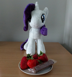 Size: 1500x1598 | Tagged: safe, rarity, pony, unicorn, g4, 4de, chocolate, desk, female, food, irl, mare, photo, plate, plushie, rarity looking at food, solo, strawberry, waifu dinner