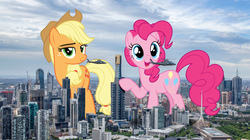 Size: 2500x1400 | Tagged: safe, artist:dashiesparkle, artist:theotterpony, applejack, pinkie pie, earth pony, pony, g4, australia, city, cowboy hat, female, freckles, giant pony, hat, helicopter, highrise ponies, irl, macro, mare, melbourne, open mouth, photo, ponies in real life, raised hoof, stetson, story in the source