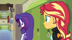 Size: 1100x618 | Tagged: safe, screencap, rarity, sunset shimmer, equestria girls, g4, my little pony equestria girls: friendship games, clothes, hallway, jacket, leather jacket, lockers, rear view, skirt
