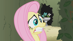 Size: 1280x720 | Tagged: safe, screencap, fluttershy, pony, g4, the return of harmony, canterlot hedge maze, faic, female, flower, gritted teeth, hedge maze, mare, maze, plants, scared, solo, wide eyes