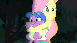 Size: 600x338 | Tagged: safe, screencap, fluttershy, spike, spike the regular dog, dog, equestria girls, g4, my little pony equestria girls: legend of everfree, animated, camp everfree outfits, cap, clothes, gif, hat, hug, mushroom, shorts, sleeveless, tank top, tree
