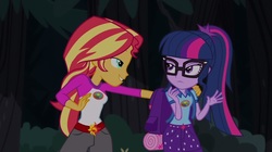 Size: 1100x618 | Tagged: safe, screencap, sci-twi, sunset shimmer, twilight sparkle, equestria girls, g4, my little pony equestria girls: legend of everfree, backpack, camp everfree outfits, clothes, duo, female, glasses, lidded eyes, out of context, shipping fuel, shorts, sun, tree