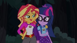 Size: 1100x618 | Tagged: safe, screencap, sci-twi, sunset shimmer, twilight sparkle, equestria girls, g4, my little pony equestria girls: legend of everfree, backpack, camp everfree outfits, clothes, glasses, shorts, sun, tree