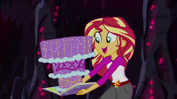 Size: 1280x720 | Tagged: safe, screencap, sunset shimmer, equestria girls, g4, my little pony equestria girls: legend of everfree, book, cake, camp everfree outfits, clothes, crystal gala, female, food, legend you were meant to be, open mouth, shorts, solo