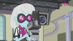 Size: 1136x638 | Tagged: safe, screencap, photo finish, equestria girls, equestria girls specials, g4, my little pony equestria girls: dance magic, canterlot high, female, glasses, solo, teletoon, video camera