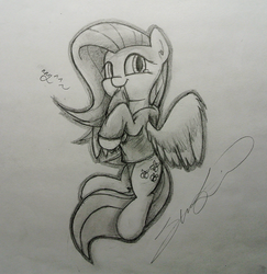 Size: 1050x1080 | Tagged: safe, artist:chickensteve, fluttershy, pony, g4, clothes, female, grayscale, hoodie, looking at you, monochrome, on side, simple background, smiling, solo, traditional art