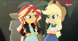 Size: 1366x726 | Tagged: safe, screencap, applejack, sunset shimmer, equestria girls, equestria girls specials, g4, my little pony equestria girls: movie magic, duo, faic, looking at each other, plant, smiling, smug, smugset shimmer, teletoon