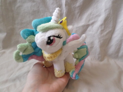 Size: 4608x3456 | Tagged: safe, artist:shadowkrafts, princess celestia, pony, g4, high res, in goliath's palm, irl, photo, plushie, solo