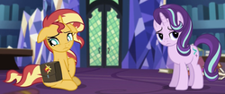 Size: 1280x540 | Tagged: safe, screencap, starlight glimmer, sunset shimmer, pony, unicorn, equestria girls, g4, mirror magic, spoiler:eqg specials, book, cropped, crystal, door, frown, library, looking away, saddle bag, twilight's castle