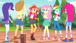 Size: 996x566 | Tagged: safe, screencap, applejack, fluttershy, pinkie pie, rainbow dash, rarity, sunset shimmer, equestria girls, g4, legend of everfree, balloon, boots, camp everfree outfits, clothes, converse, cowboy boots, embrace the magic, female, hand on hip, humane five, jeans, pants, pier, raised leg, rear view, shoes, shorts, sneakers, socks, sun, tree, wristband
