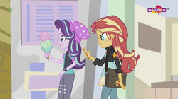 Size: 1136x638 | Tagged: safe, screencap, starlight glimmer, sunset shimmer, equestria girls, equestria girls specials, g4, my little pony equestria girls: mirror magic, beanie, canterlot mall, cellphone, female, food, geode of empathy, hat, ice cream, magical geodes, phone, teletoon