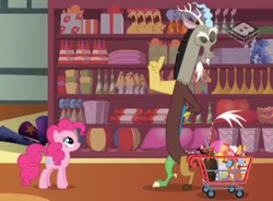 Size: 869x640 | Tagged: safe, screencap, discord, pinkie pie, draconequus, earth pony, pony, discordant harmony, g4, ball, balloon, beach ball, boomerang (tv channel), duo, eyes closed, hat, lava lamp, party hat, present, rubber chicken, shelf, shopping cart, store, volcano