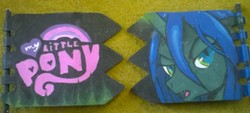 Size: 1600x721 | Tagged: safe, artist:40kponyguy, queen chrysalis, g4, female, looking at you, my little pony logo, photo, solo, traditional art