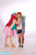 Size: 1365x2048 | Tagged: safe, artist:shadeila, pinkie pie, rainbow dash, human, g4, cheek kiss, clothes, cosplay, costume, desucon, female, high heels, irl, irl human, kissing, lesbian, photo, rainbow socks, ship:pinkiedash, shipping, shoes, socks, striped socks