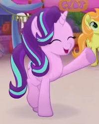 Size: 251x315 | Tagged: safe, screencap, cantaloupe (g4), starlight glimmer, earth pony, pony, unicorn, g4, my little pony: the movie, background pony, cropped, cute, eyes closed, female, glimmerbetes, happy, heart, hoof heart, mare, open mouth, raised hoof, raised leg, smiling, solo focus, trailer, underhoof, waving