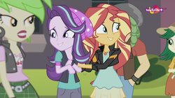 Size: 1136x638 | Tagged: safe, screencap, cherry crash, sandalwood, starlight glimmer, sunset shimmer, sweet leaf, equestria girls, equestria girls specials, g4, my little pony equestria girls: mirror magic, background human, geode of empathy, grin, magical geodes, nervous, smiling, teletoon