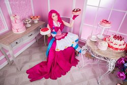 Size: 1600x1067 | Tagged: safe, artist:evange, pinkie pie, human, g4, cake, clothes, cosplay, costume, dignified wear, dress, food, gala dress, humanized, irl, irl human, looking at you, photo, sitting, smiling, solo, table