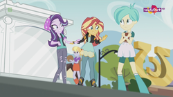 Size: 1136x638 | Tagged: safe, screencap, cloudy kicks, starlight glimmer, sunset shimmer, tennis match, equestria girls, equestria girls specials, g4, my little pony equestria girls: mirror magic, background human, basketball, beanie, book, boots, clothes, female, hat, shoes, skirt, teletoon