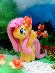 Size: 1500x2007 | Tagged: safe, artist:atelok, fluttershy, pony, g4, felt, flower, flower in hair, irl, looking away, needle felted, no mouth, photo, plushie, solo, spread wings, standing, wings
