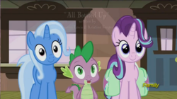 Size: 1392x780 | Tagged: safe, screencap, spike, starlight glimmer, trixie, dragon, pony, unicorn, all bottled up, g4, animation error, cute, diatrixes, discovery family, discovery family logo, female, glimmerbetes, hair flip, logo, male, mare, missing eyelashes, saddle bag, smiling, spikabetes, the amazing trio of friendship, thousand yard stare, train station, watermark
