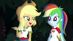 Size: 1280x720 | Tagged: safe, screencap, applejack, rainbow dash, equestria girls, g4, my little pony equestria girls: legend of everfree, belt, camp everfree outfits, clothes, cowboy hat, denim shorts, duo, female, freckles, hat, open mouth, pointing, smiling, stetson, talking