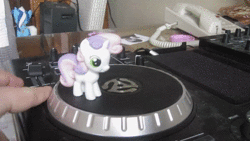 Size: 1280x720 | Tagged: safe, sweetie belle, pony, g4, animated, irl, no sound, photo, spinning, toy, turntable, turntable pony, webm, you spin me right round