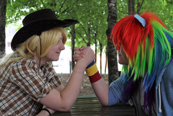 Size: 4272x2848 | Tagged: safe, artist:shadeila, applejack, rainbow dash, human, g4, arm wrestling, clothes, cosplay, costume, high res, irl, irl human, photo