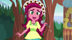 Size: 1280x720 | Tagged: safe, screencap, gloriosa daisy, equestria girls, g4, my little pony equestria girls: legend of everfree, awkward, female, magical geodes, microphone, poker face, smiling, solo