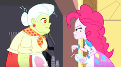 Size: 1278x718 | Tagged: safe, screencap, granny smith, pinkie pie, equestria girls, g4, my little pony equestria girls: summertime shorts, the art of friendship, apron, bracelet, bun, clothes, confused, ear piercing, earring, jewelry, juice, lunchlady smith, piercing, scarf, straw