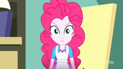 Size: 1278x718 | Tagged: safe, screencap, pinkie pie, equestria girls, g4, my little pony equestria girls: summertime shorts, the art of friendship, >:), apron, clothes, easel, evil grin, happy, looking at you, shirt, skirt, smiling, smirk, teenager, vest