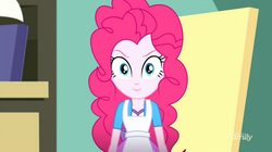 Size: 1278x718 | Tagged: safe, screencap, pinkie pie, equestria girls, g4, my little pony equestria girls: summertime shorts, the art of friendship, >:), apron, clothes, easel, evil smile, happy, looking at you, shirt, skirt, smiling, smirk, teenager, vest