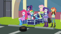 Size: 1280x720 | Tagged: safe, screencap, fluttershy, pinkie pie, rainbow dash, rarity, sci-twi, sunset shimmer, twilight sparkle, equestria girls, g4, get the show on the road, my little pony equestria girls: summertime shorts, boots, clothes, confused, female, geode of fauna, glasses, parking lot, ponytail, shoes, wheel