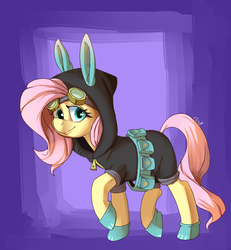 Size: 1200x1300 | Tagged: safe, artist:passigcamel, fluttershy, pony, g4, belt, bunny ears, clothes, costume, dangerous mission outfit, female, goggles, hoodie, looking at you, mare, raised hoof, smiling, solo, utility belt