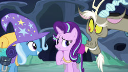 Size: 1280x720 | Tagged: safe, screencap, discord, starlight glimmer, trixie, draconequus, pony, unicorn, g4, to where and back again, clothes, female, grin, hat, male, mare, raised eyebrow, raised hoof, smiling, trio, trixie's hat, wizard hat