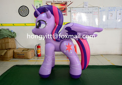 Size: 800x559 | Tagged: safe, twilight sparkle, alicorn, inflatable pony, pony, g4, bootleg, box, cardboard box, darts, female, hongyi, indoors, inflatable, inflatable alicorn, irl, mare, obtrusive watermark, opaque inflatable, photo, solo, standing, twilight sparkle (alicorn), watermark, whiteboard