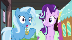 Size: 1280x720 | Tagged: safe, screencap, starlight glimmer, trixie, all bottled up, g4, duo, raised eyebrow, raised hoof, saddle bag, train, train station