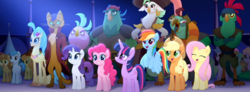 Size: 1920x704 | Tagged: safe, screencap, applejack, boyle, cantaloupe (g4), capper dapperpaws, captain celaeno, fluttershy, lix spittle, mullet (g4), pinkie pie, princess skystar, rainbow dash, rarity, squabble, twilight sparkle, abyssinian, alicorn, classical hippogriff, earth pony, hippogriff, parrot pirates, pegasus, pony, unicorn, anthro, g4, my little pony: the movie, anthro with ponies, background pony, background pony audience, chest fluff, female, happy, male, mane six, mare, pirate, rainbow (song), stallion, twilight sparkle (alicorn), unnamed character, unnamed pony