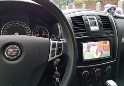 Size: 2872x2004 | Tagged: safe, maud pie, rarity, g4, cadillac, car, high res, irl, photo, plushie, screen, steering wheel, watching